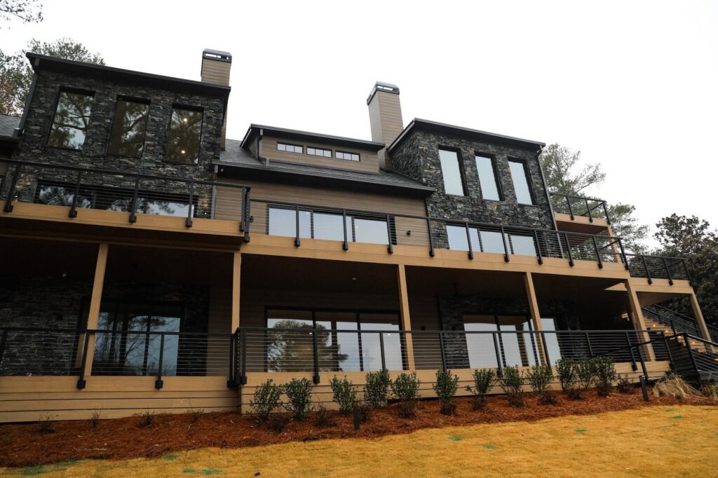 lake-windward-timbertech-deck-trespa-siding- Lake Windward home with TimberTech decking and Trespa siding by Boyce Design + Build.