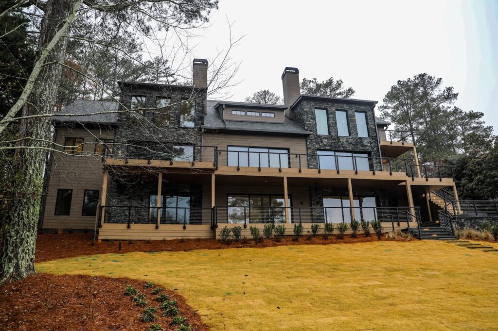 lake-windward-timbertech-deck-trespa-siding- Patio-to-deck connection with TimberTech decking at Lake Windward.