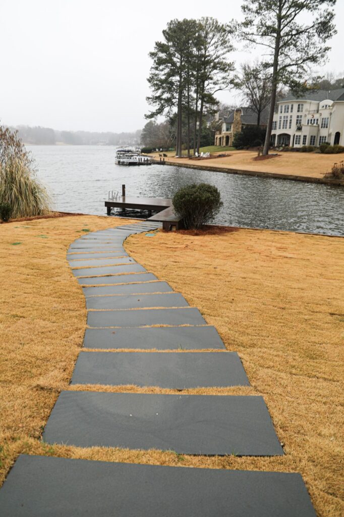lake-windward-timbertech-deck-trespa-siding- Rear elevation of Lake Windward home showing full TimberTech deck.