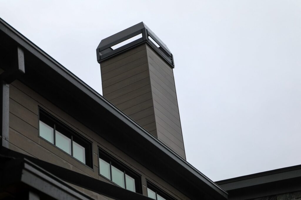 lake-windward-timbertech-deck-trespa-siding- TimberTech deck lighting and step design by Boyce Design + Build.