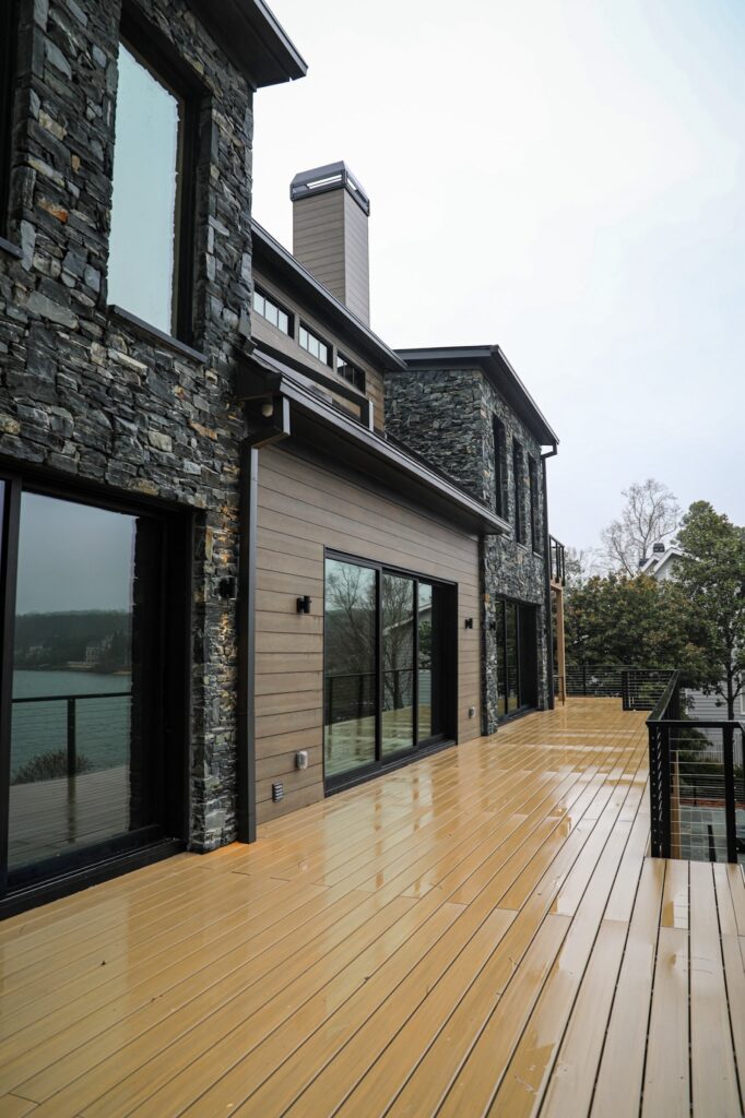 lake-windward-timbertech-deck-trespa-siding- TimberTech stairs and deck edge with concealed fasteners.