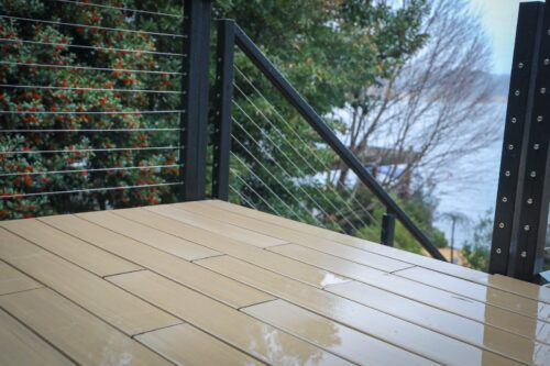 TimberTech deck stairs leading toward the lake at Lake Windward residence.