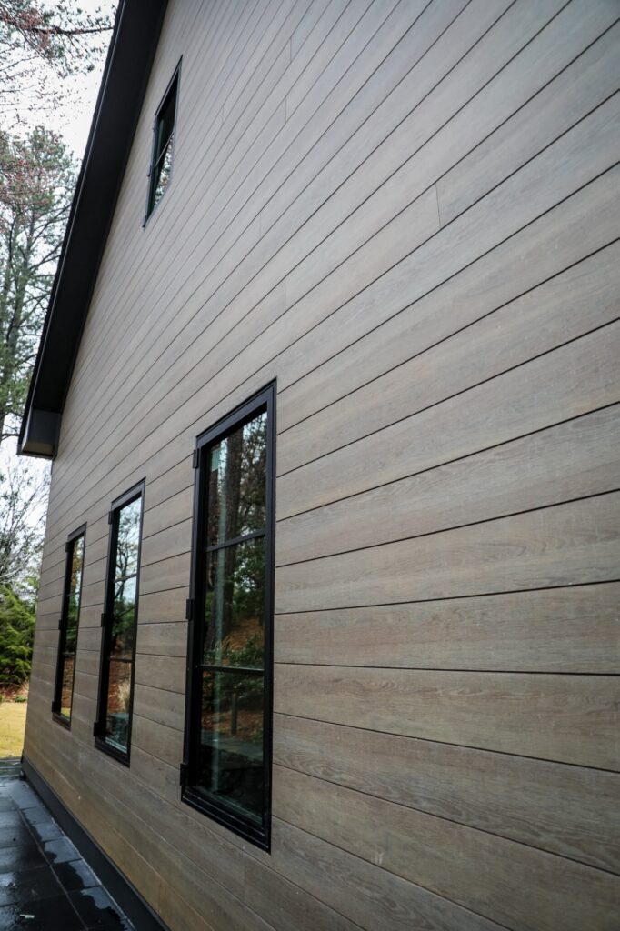 lake-windward-timbertech-deck-trespa-siding- TimberTech deck boards showing rich tone variation in natural light.