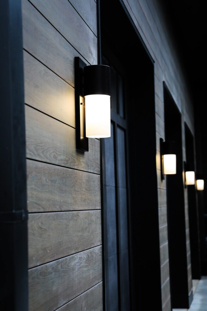 lake-windward-timbertech-deck-trespa-siding- TimberTech deck transition to lower patio by Boyce Design + Build.