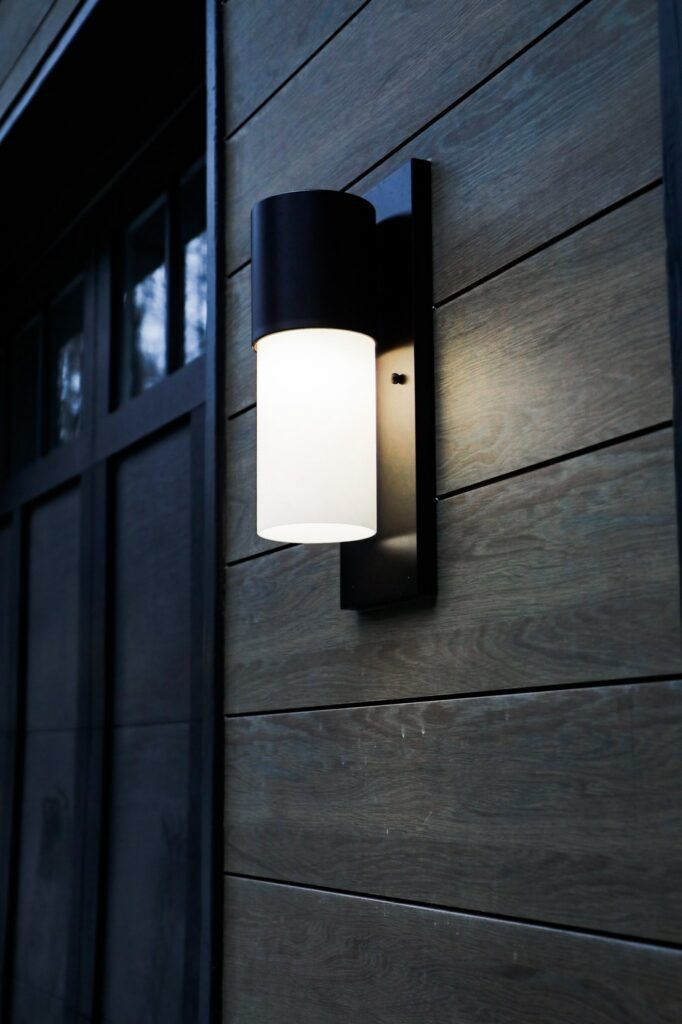 lake-windward-timbertech-deck-trespa-siding- Exterior view of Lake Windward home with TimberTech deck and Trespa siding.