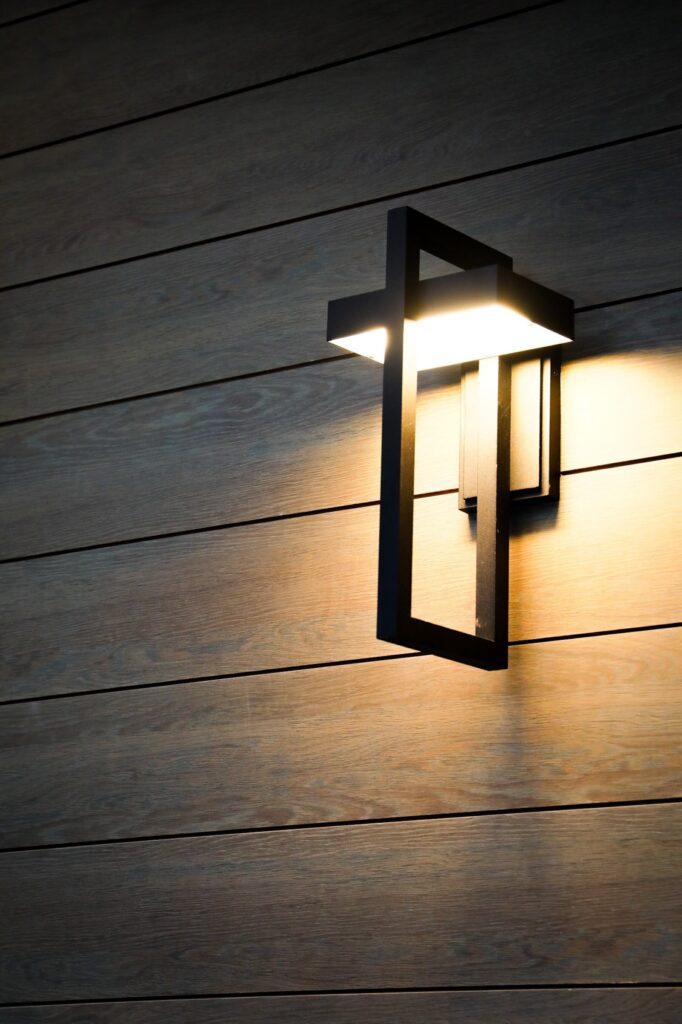 lake-windward-timbertech-deck-trespa-siding- Evening view of TimberTech deck lighting at Lake Windward.