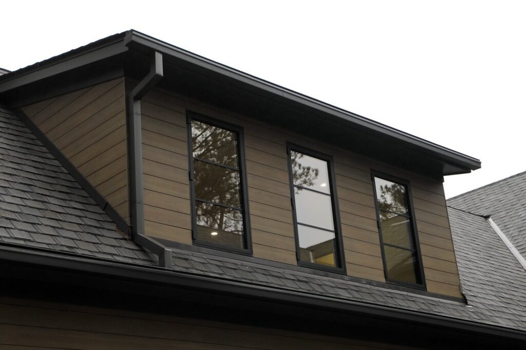 lake-windward-timbertech-deck-trespa-siding- Composite TimberTech decking with hidden fastener installation.