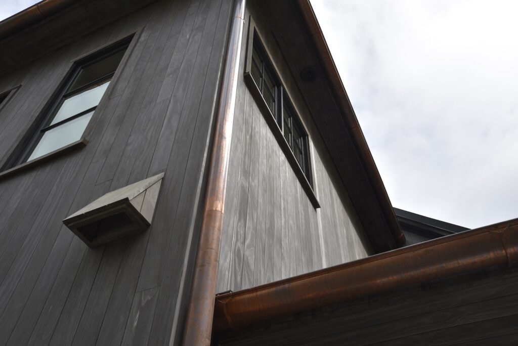 lakefront dock with refined architectural transitions near the boat dock.