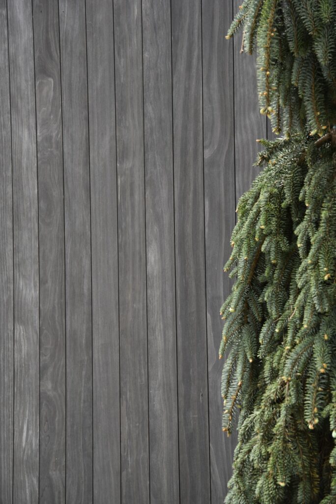 Accoya Grey vent hood with clean vertical grain lines at the Lake Burton residence.