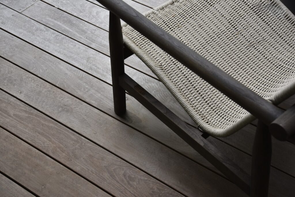 lakefront deck with clean vertical grain lines near the boat dock.
