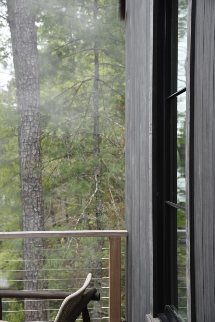 Ipe drink rail with clean vertical grain lines at the home’s main façade.