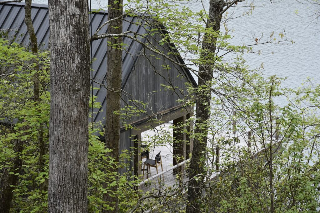 Accoya Grey soffits highlighting material texture near the boat dock.