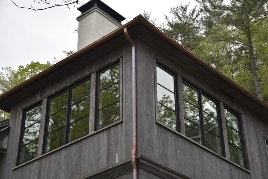 outdoor living space framing the outdoor entertainment area on the upper deck level.