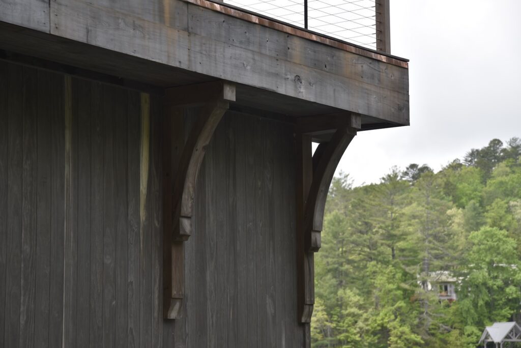 outdoor living space with clean vertical grain lines on the upper deck level.