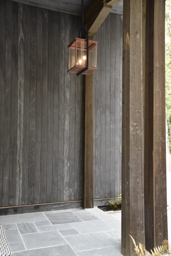 Accoya Grey cladding showing detailed craftsmanship on the upper deck level.