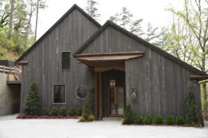 Accoya Grey soffits framing the outdoor entertainment area along the waterfront deck.