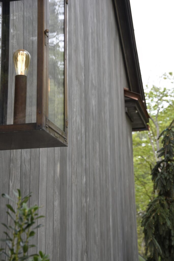 Ipe decking shown in natural light at the home’s main façade.