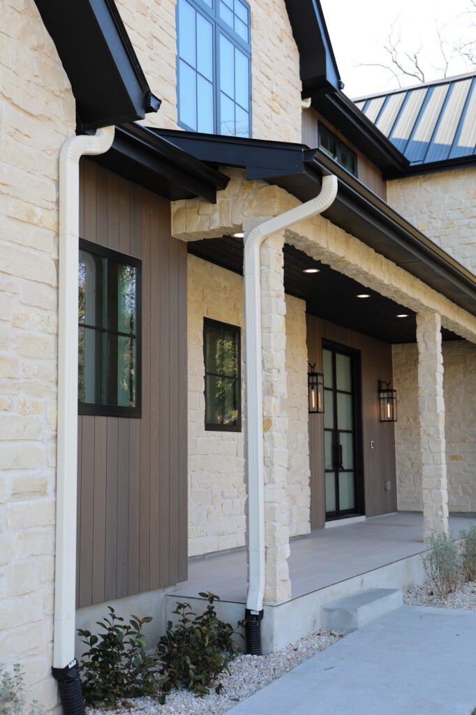 Thermally modified ash siding in Vivid Silver finish framing the contemporary exterior within the contemporary exterior design.