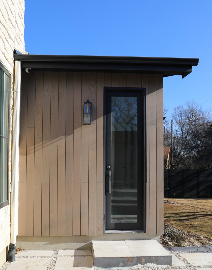 Thermally modified ash siding in Vivid Silver finish shown in natural daylight on the modern façade in Austin, Texas.