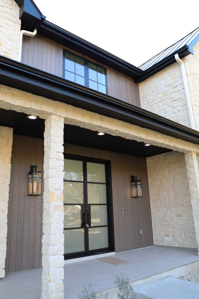 Thermory Benchmark Ash Vivid Silver vertical siding highlighting clean architectural lines on the exterior wall plane.