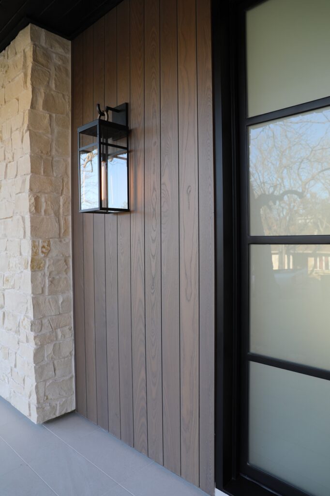 Thermory Benchmark Ash Vivid Silver cladding capturing silver tone variation at a Paradisa Homes residence in Austin.