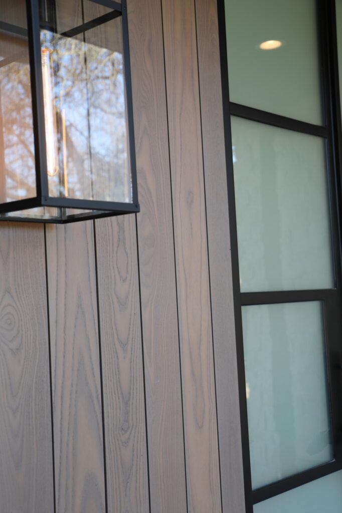 Thermory Vivid Silver exterior boards accenting the modern façade on the modern façade in Austin, Texas.