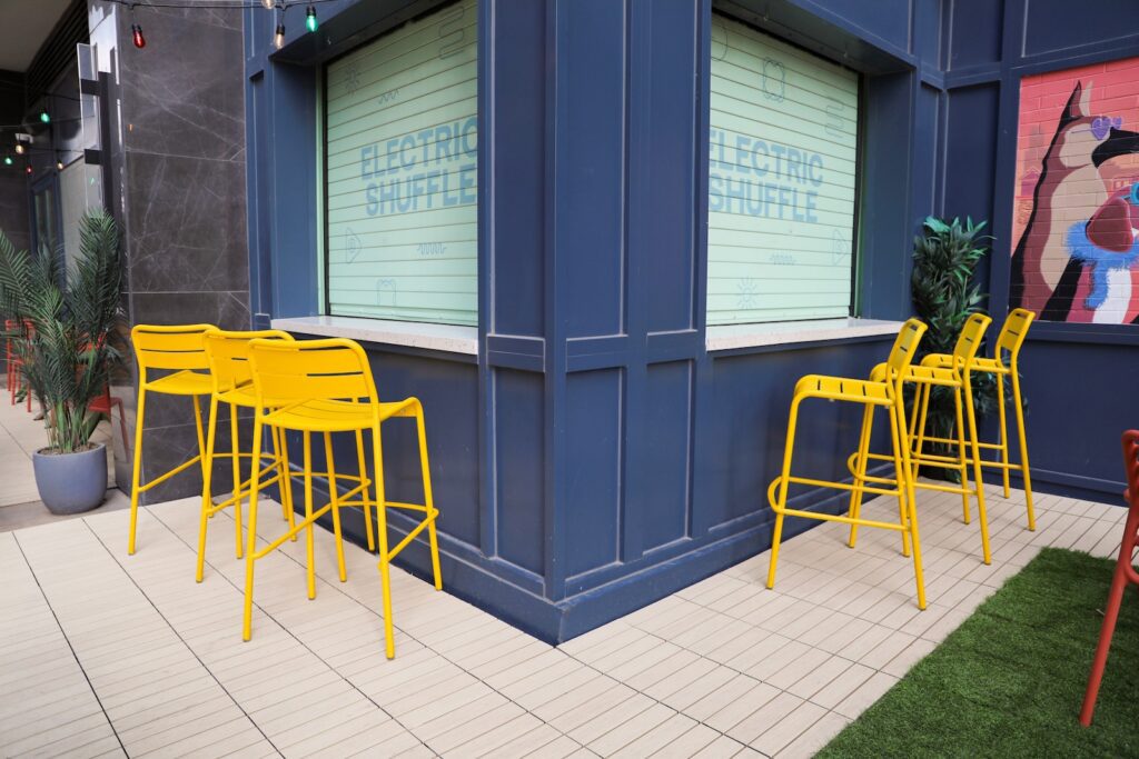 Outdoor nightlife patio with deck and turf tiles