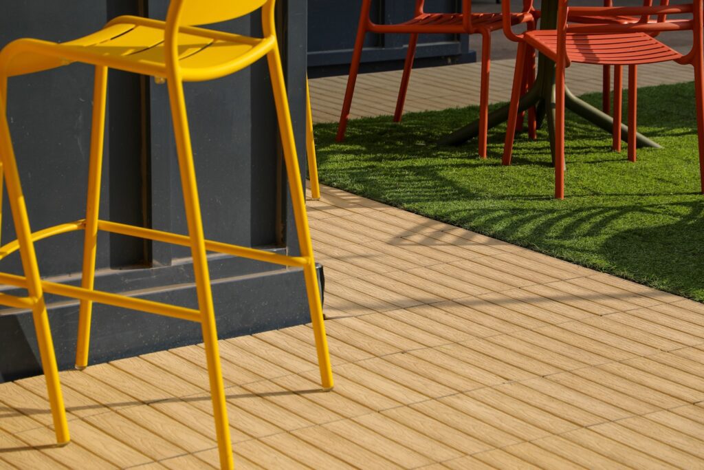 Outdoor furniture placed on composite deck tiles
