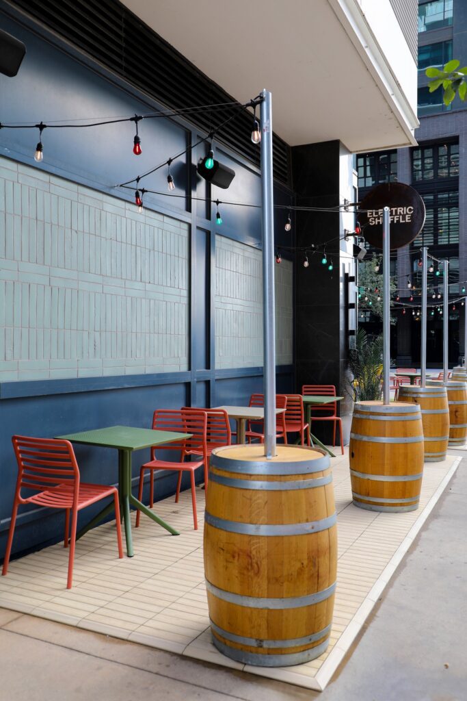 Wide view of Electric Shuffle patio with deck tiles