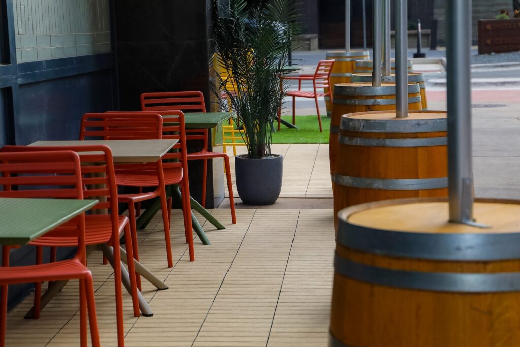 Outdoor bar seating installed on NewTechWood composite deck tiles