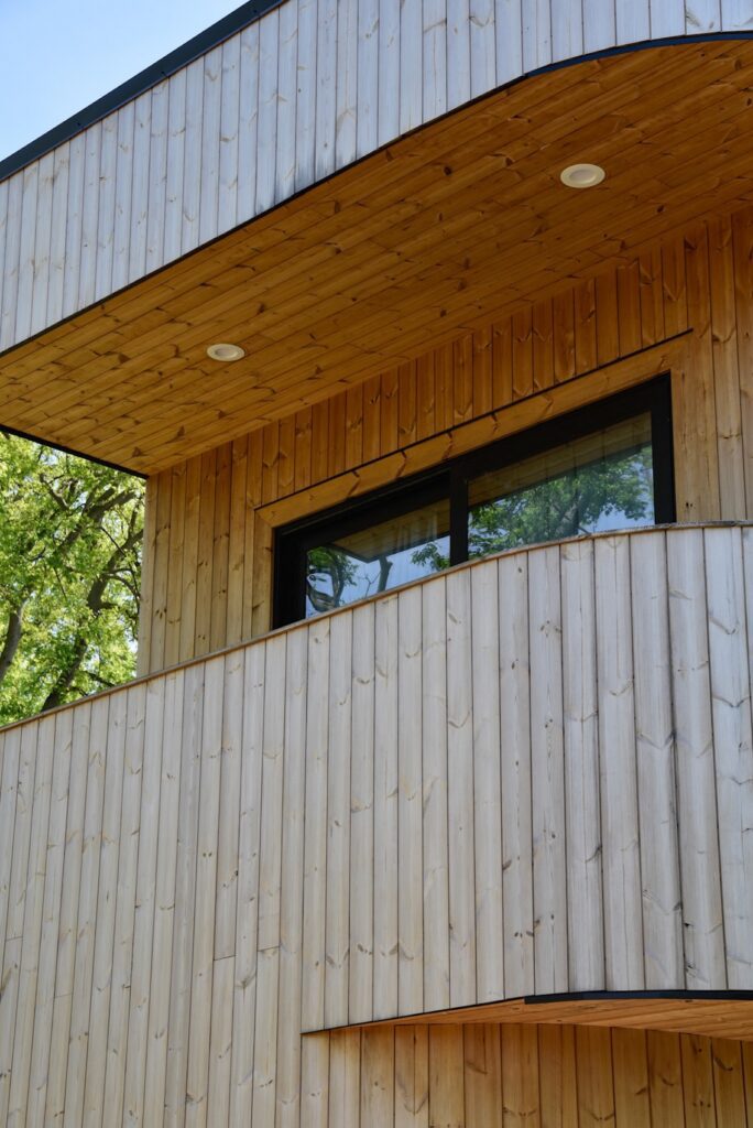Thermally modified knotty pine wood used for exterior cladding and decking
