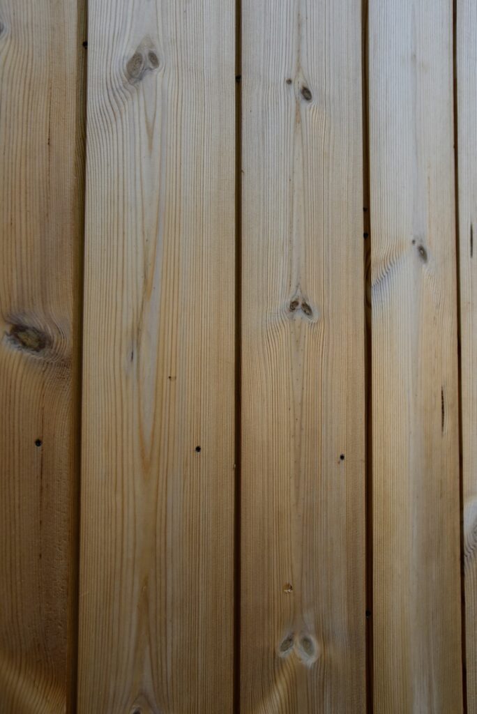 Thermory knotty pine cladding detail with natural knots and variation