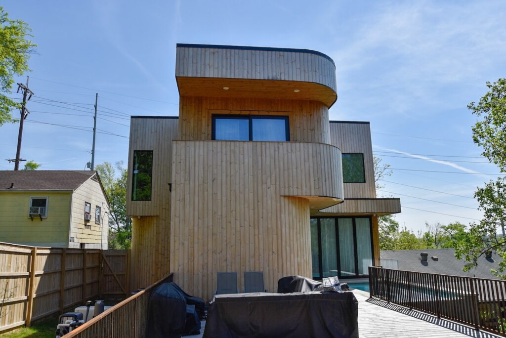 Thermory knotty pine cladding and soffit on modern residential project
