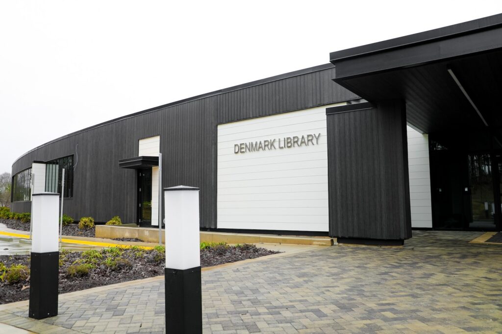 Denmark Library’s 5th Branch features approximately 10,000 square feet of NewTechWood All Weather Siding in Hawaiian Charcoal across exterior cladding, trim, and interior ceiling applications. The project blends sustainable material selection with modern civic architecture, creating a durable, low-maintenance building designed to stay connected to the surrounding landscape.
