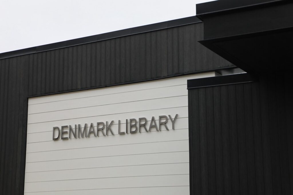 Denmark Library’s 5th Branch features approximately 10,000 square feet of NewTechWood All Weather Siding in Hawaiian Charcoal across exterior cladding, trim, and interior ceiling applications. The project blends sustainable material selection with modern civic architecture, creating a durable, low-maintenance building designed to stay connected to the surrounding landscape.