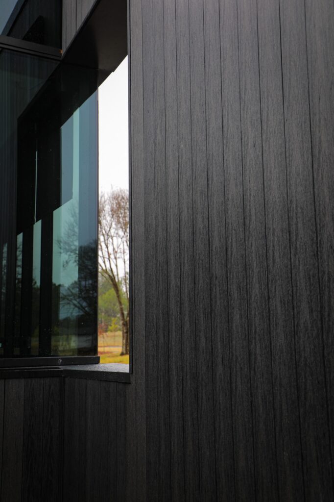 Denmark Library’s 5th Branch features approximately 10,000 square feet of NewTechWood All Weather Siding in Hawaiian Charcoal across exterior cladding, trim, and interior ceiling applications. The project blends sustainable material selection with modern civic architecture, creating a durable, low-maintenance building designed to stay connected to the surrounding landscape.