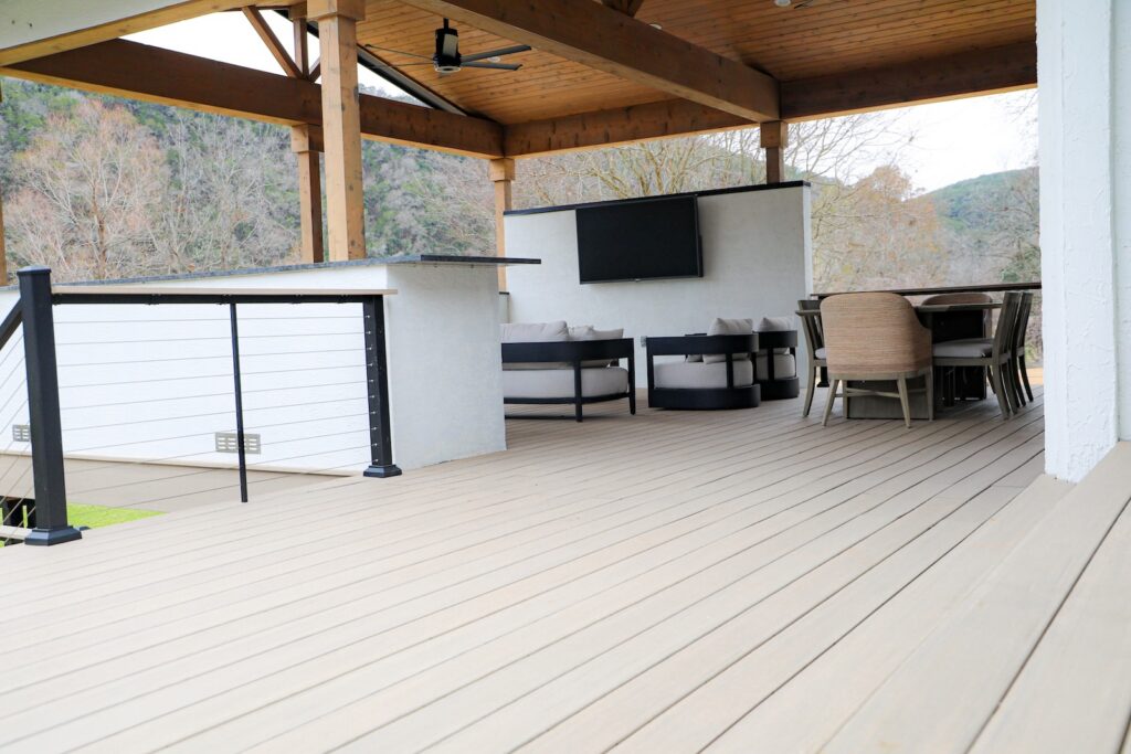 Outdoor kitchen and TimberTech deck at Lake Austin residence