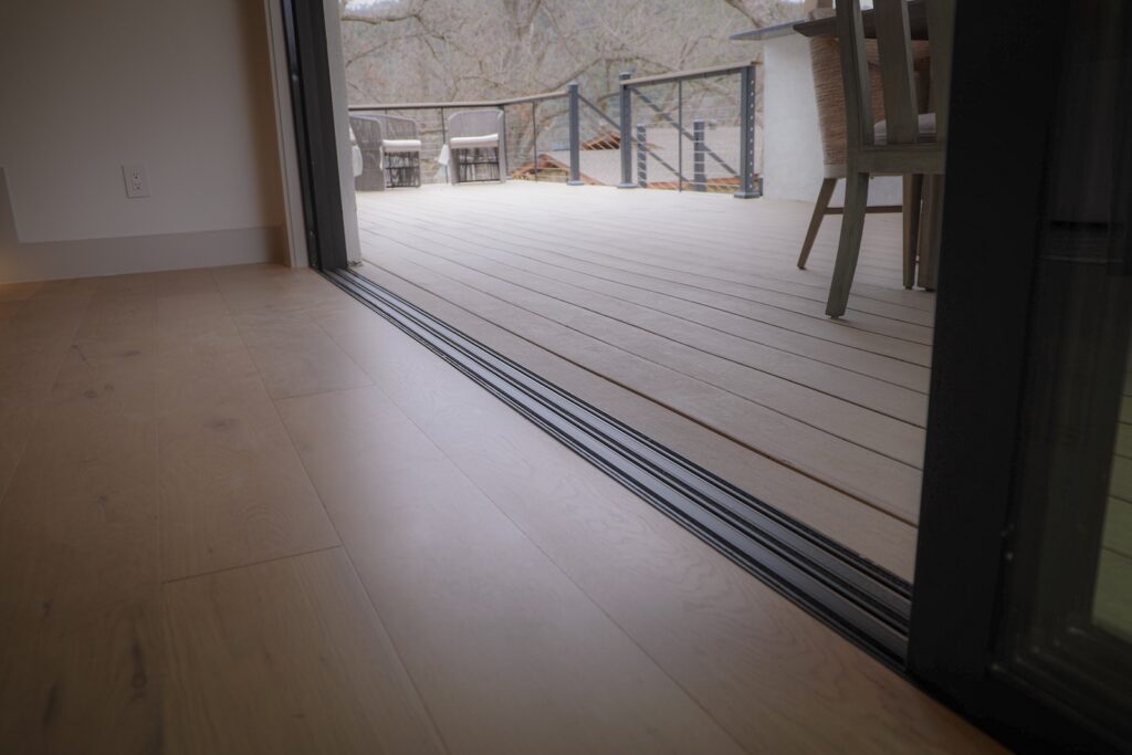 TimberTech French White Oak decking in modern lakeside setting