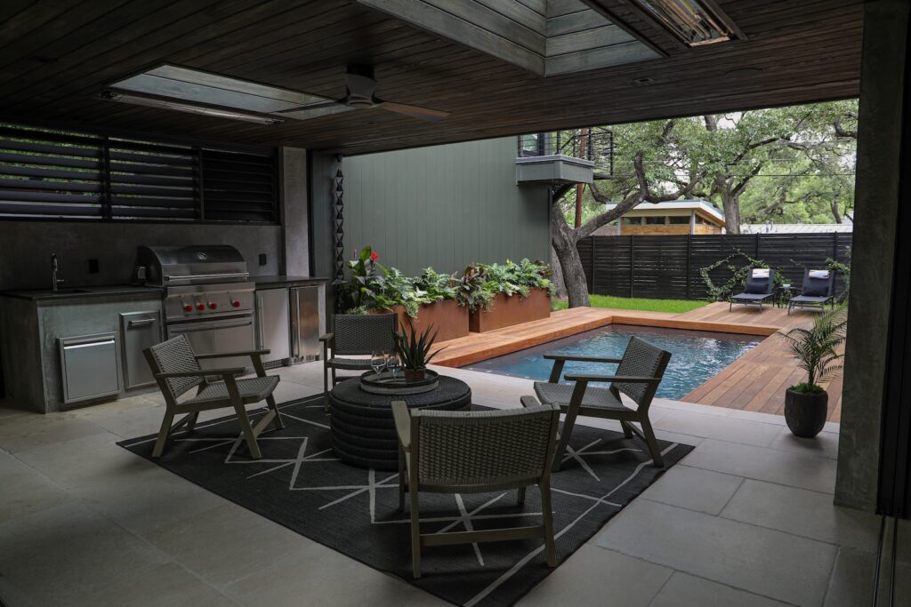 Modern home exterior featuring custom Garapa hardwood pool decking