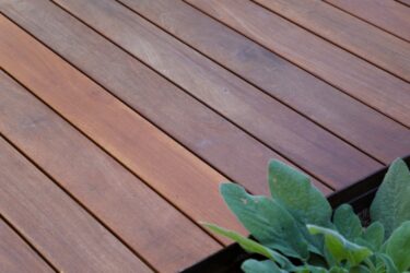 Close-up of Ipe deck boards showing natural reddish-brown color variation