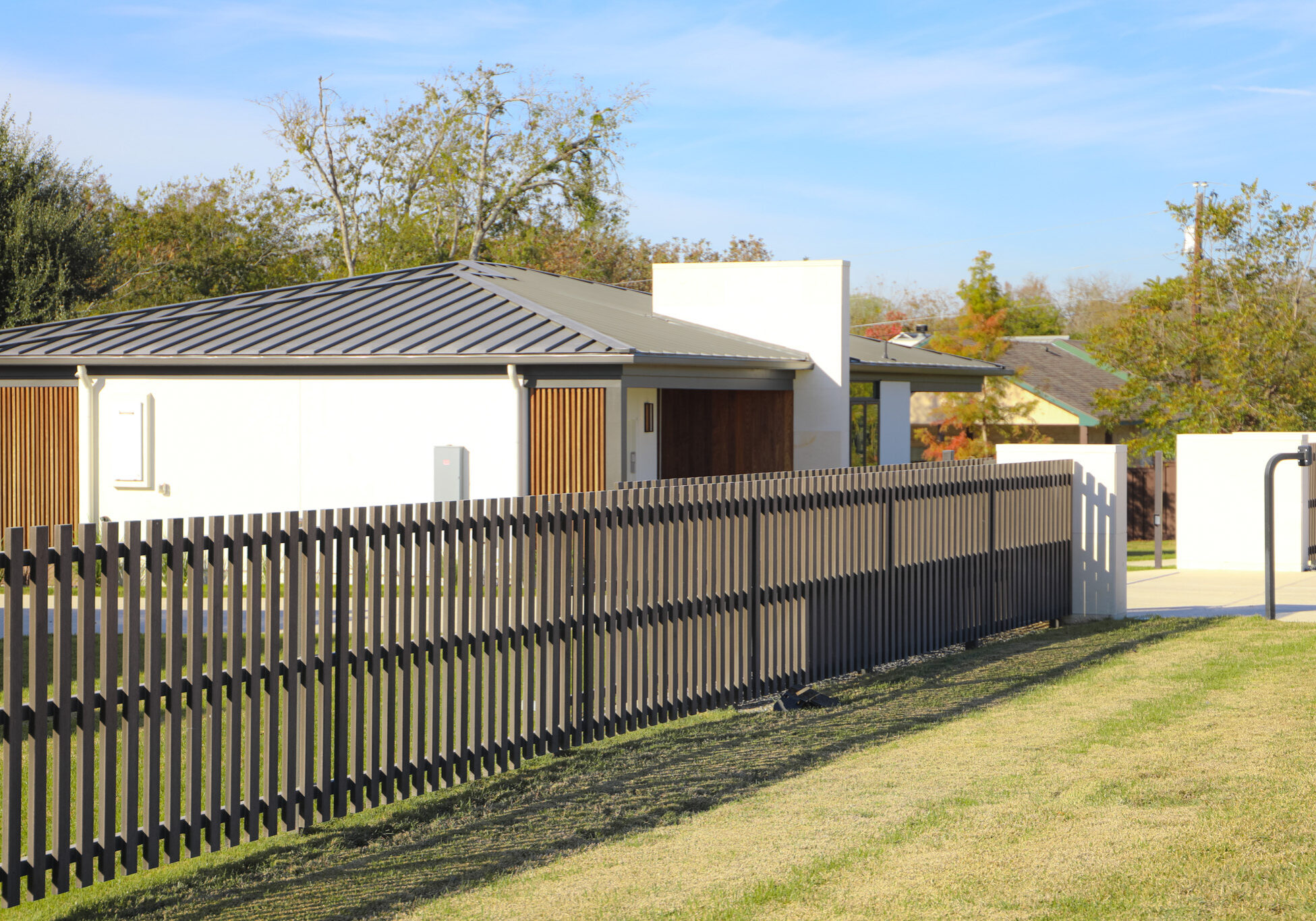 Acre by Modern Mill fence surrounding modern home in Austin, Texas